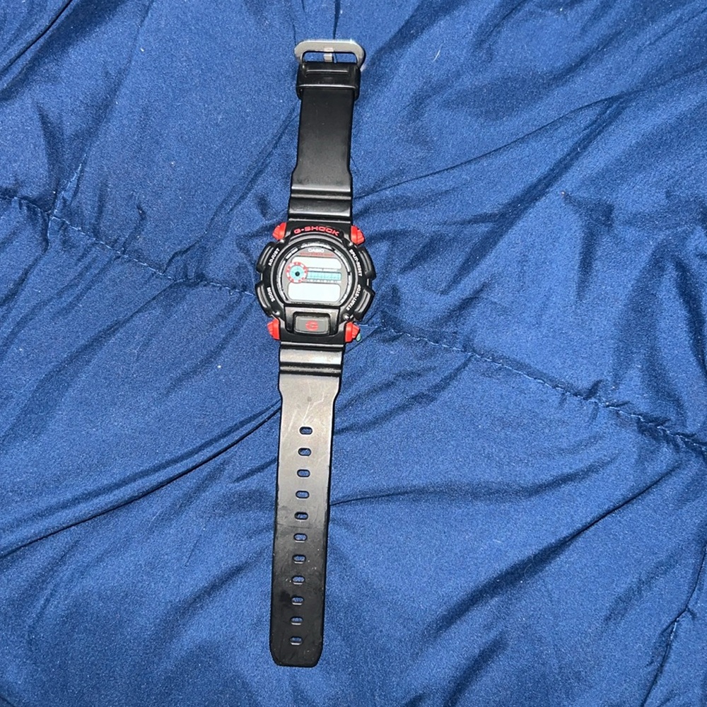 red and black g shock watch